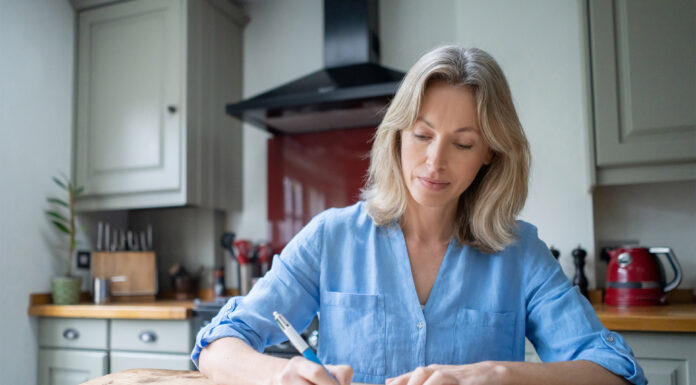 A woman writing a note