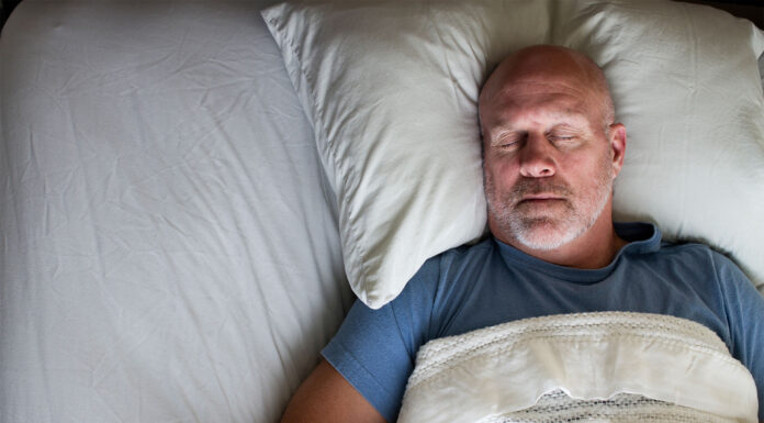 A man sleeping in bed