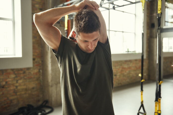 A man stretching his arm