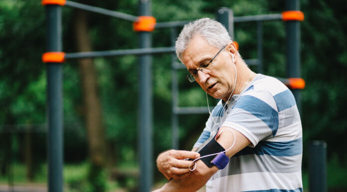 A man checking his phone on arm