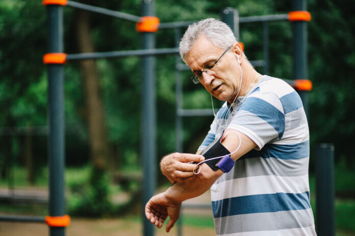 A man checking his phone on arm