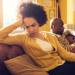 African American couple having relationship difficulties at home.