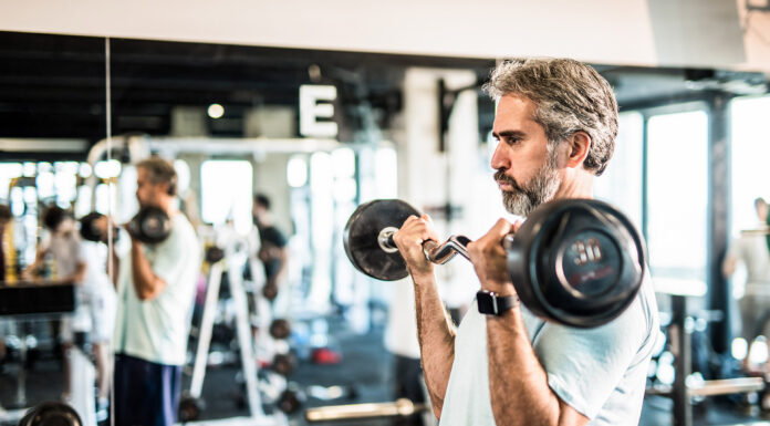 Old man working out at gym