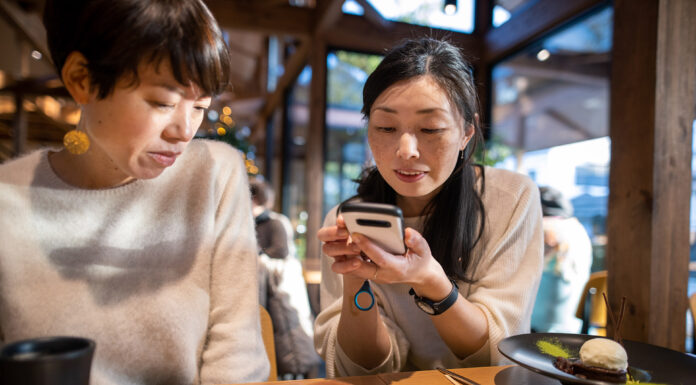 Women looking at a donut