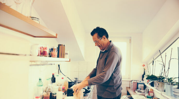 A man in kitchen