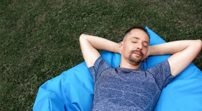 A man sleeping on grass