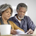 Senior couple looking at documents