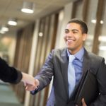 young man shakes hands with his potential new boss