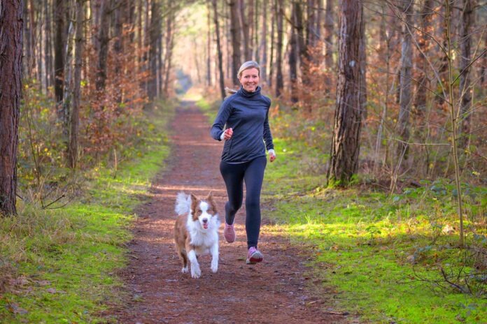 Running a woman and a dog