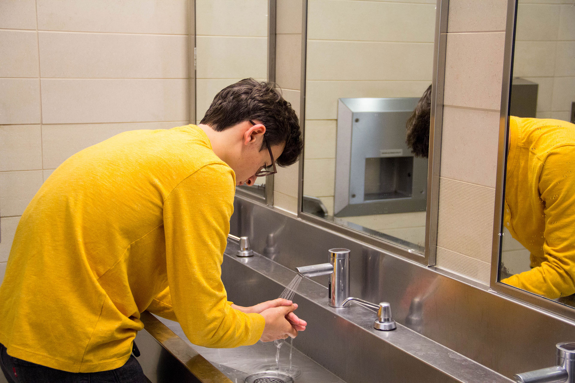 A man washing his hands