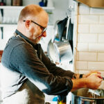 Man cooking at stove