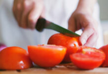 Slicing tomatoes with a knife
