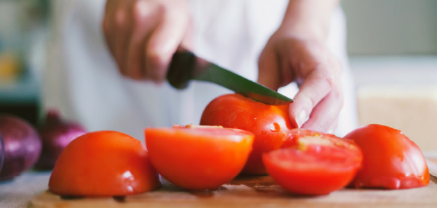 Slicing tomatoes with a knife