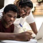 Mom helping son with homework