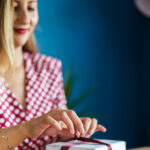 Woman wrapping holiday gift