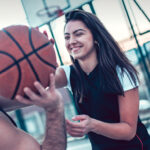 Young couple playing basketball