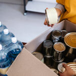 Volunteers packing up boxes of food