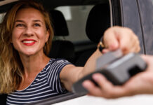 Woman smiling at drive-thru window
