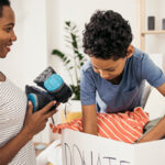 Mother and son packing donations.