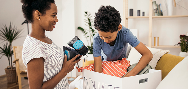 Mother and son packing donations.