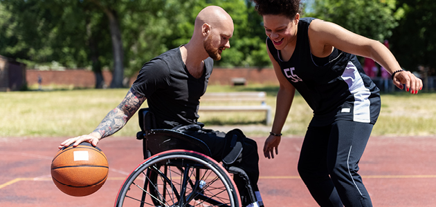 Person in wheelchair playing basketball