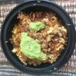 Breakfast bowl with eggs and guacamole