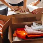 People packing boxes for a clothing drive