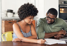 Man and woman looking at paperwork together