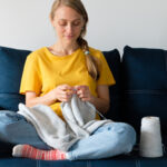 Woman knitting blanket