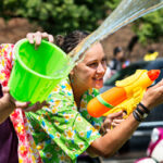 2 people having a water fight