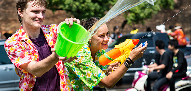 2 people having a water fight