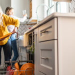 Kids emptying a dishwasher