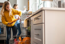 Kids emptying a dishwasher