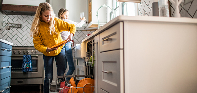 Kids emptying a dishwasher