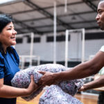 Two people handling disaster relief supplies