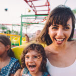 Woman and 2 children on rollercoaster