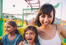 Woman and 2 children on rollercoaster