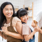 Family smiling in kitchen