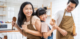 Family smiling in kitchen
