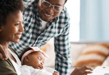 Family working at a laptop together