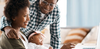 Family working at a laptop together